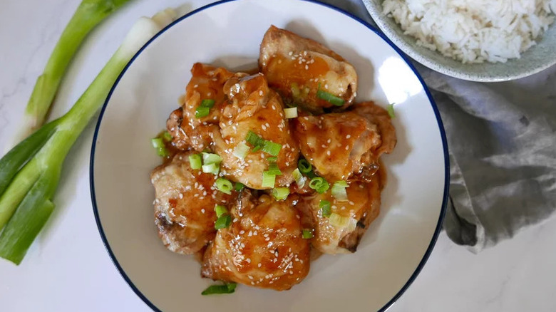Chinese-Inspired Instant Pot Chicken Thighs in white and blue bowl