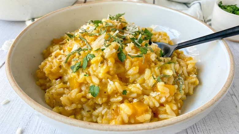 Instant Pot Butternut Squash Risotto in white bowl with utensil
