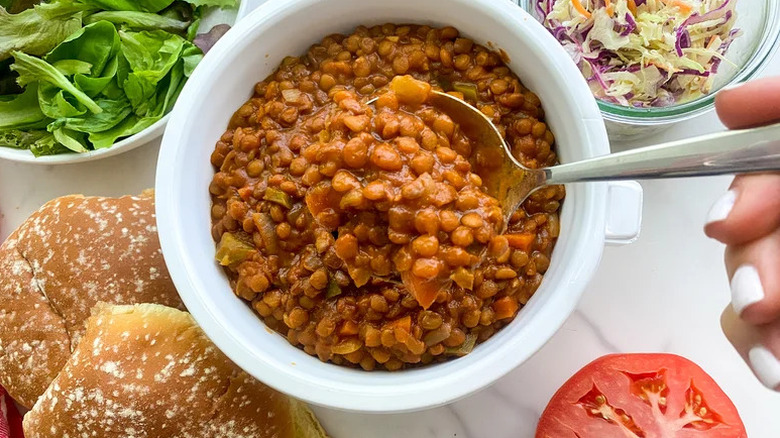 Instant Pot Lentil Sloppy Joes in white bowl with silver spoon