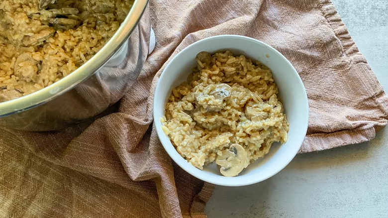 Instant Pot Mushroom Risotto in white bowl on brown towel