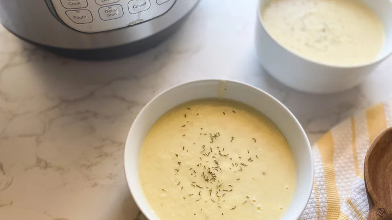 Instant Pot Potato Leek Soup in two white bowls on counter