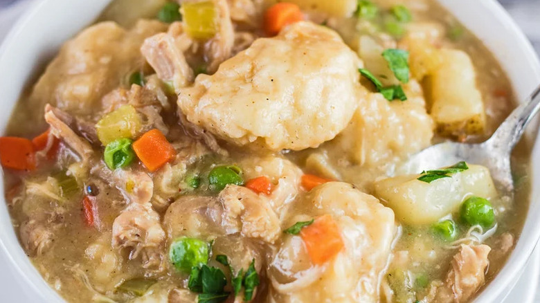 Quick Instant Pot Chicken and Dumplings in white bowl with silver spoon