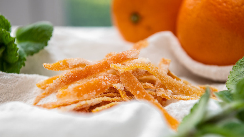Pile of candied orange peels on linen cloth