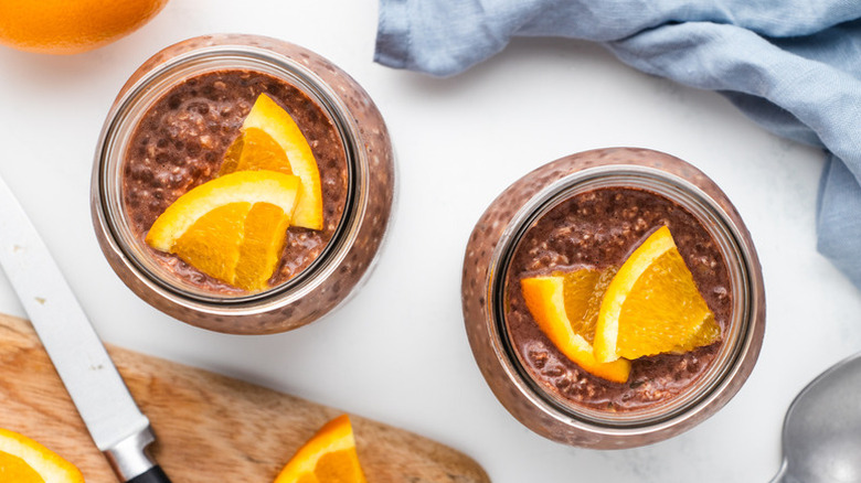 Top down view of chocolate orange overnight oats in glass jars