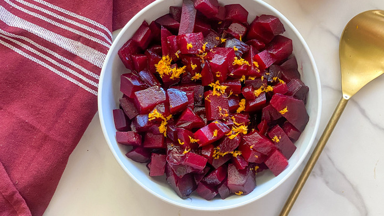 Roasted beets in bowl, topped with orange zest