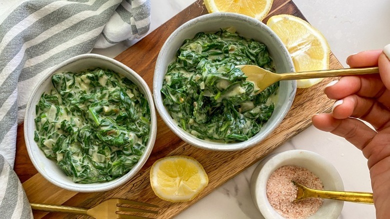 Two bowls of creamed spinach