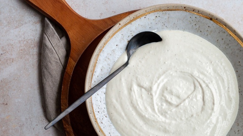 Bowl of creamy horseradish sauce with spoon