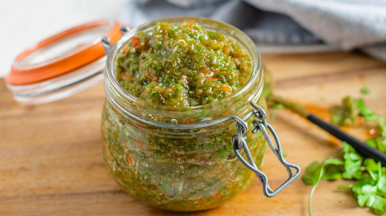 Sofrito sauce in open glass jar