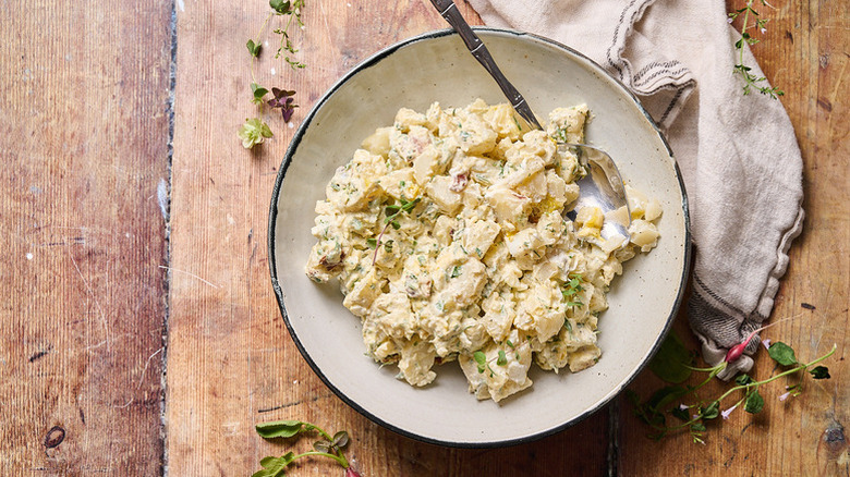 Bowl of creamy bacon and egg ranch potato salad