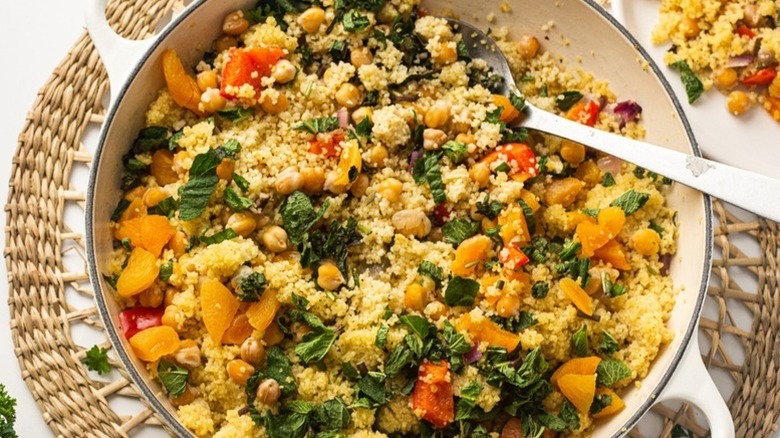 Dish of couscous with chickpeas, apricots, and fresh mint
