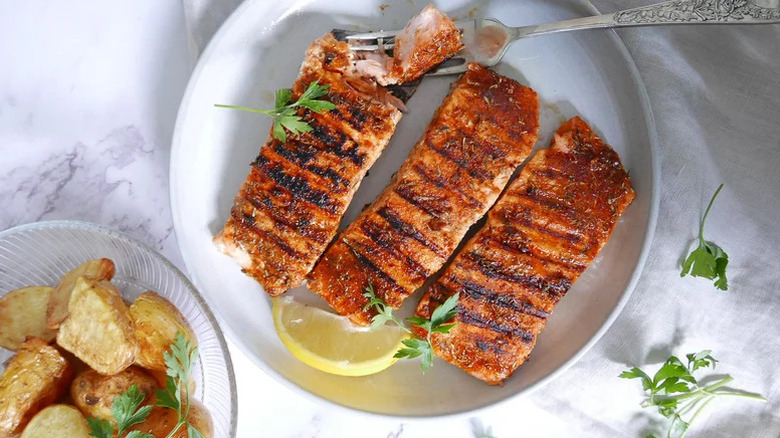 grilled salmon filets on plate