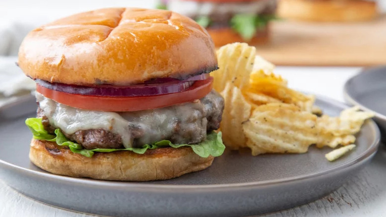 ranch burger with chips on plate