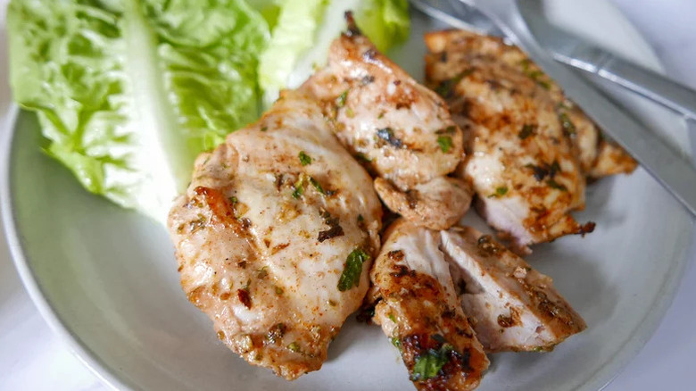Mediterranean grilled chicken with lettuce leaves