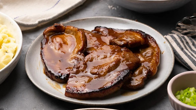 sticky hoisin pork steaks on plate