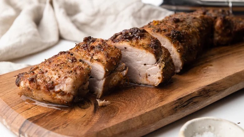 Pork tenderloin on cutting board