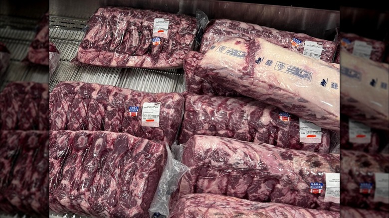 Kirkland Signature Whole Beef Ribeyes in plastic on display in Costco store