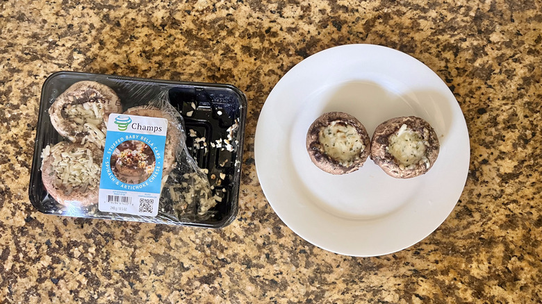 Two Spinach & Artichoke Stuffed Mushrooms on a plate
