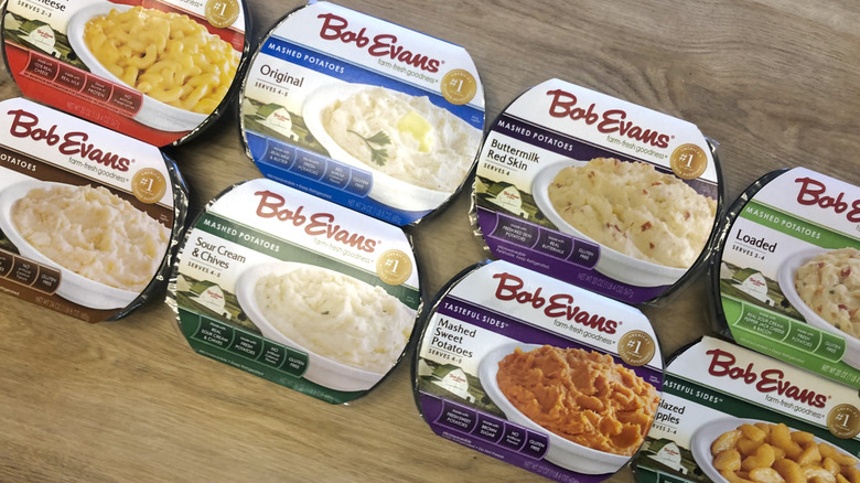 8 different Bob Evans side dishes in tubs.