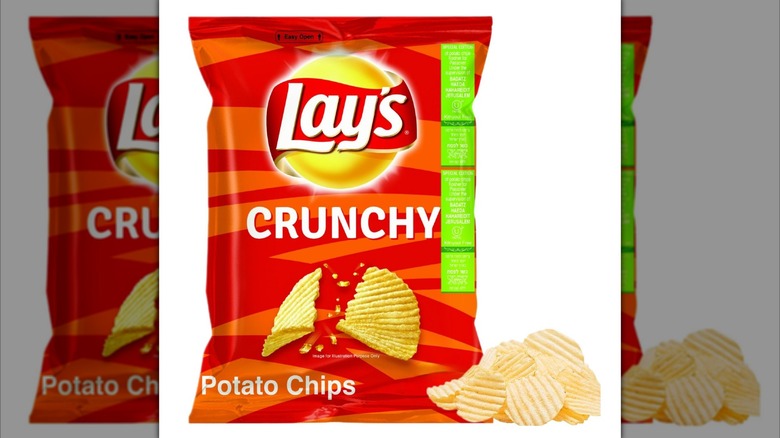 Red bag of Lay's crunchy potato chips for Passover next to small pile of chips