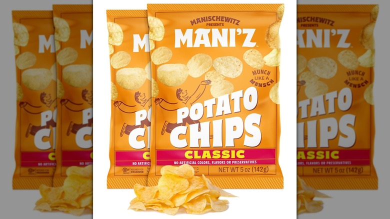 Two orange bags of Manischewitz classic potato chips for Passover next to small pile of chips