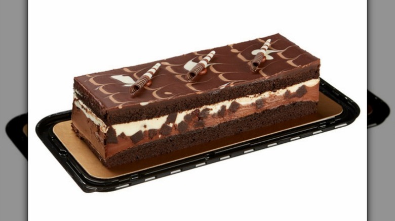 Tuxedo Mousse cake on a platter on white background