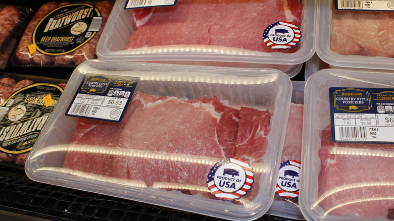 close up of various meats on display at an Aldi store