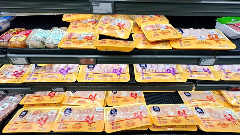 Packages of raw chicken drumsticks at Aldi