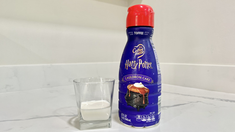 Coffee-mate Harry Potter Cauldron Cake coffee creamer poured into a cup.