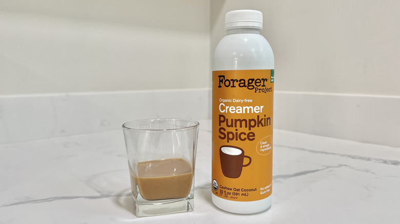 Forager Project Dairy-Free Pumpkin Spice creamer poured into a cup.