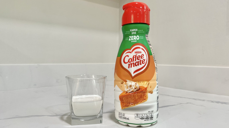 Coffee-mate Pumpkin Spice coffee creamer poured into a cup.