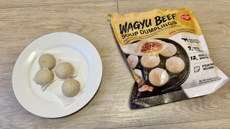 Four pieces of Synear Wagyu Beef Soup Dumplings on a plate