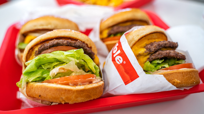 an In-N-Out tray filled with burgers of different types