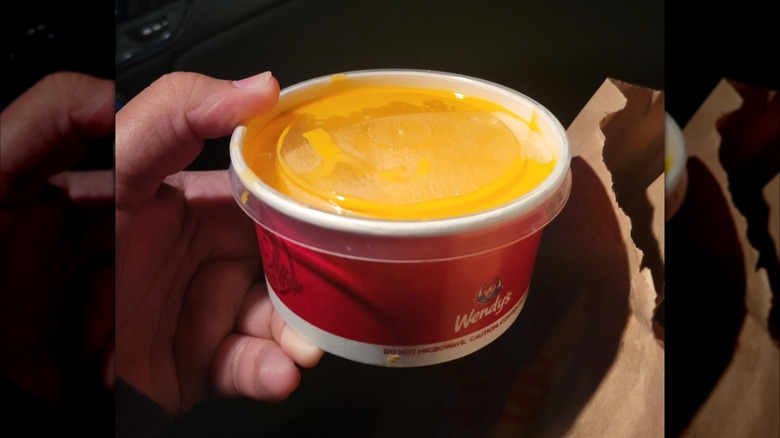 A cup of Wendy's Cheddar﻿ Cheese Sauce.