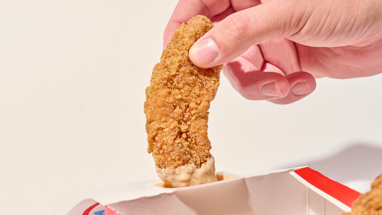 Wendy's tender dipped in a sauce.