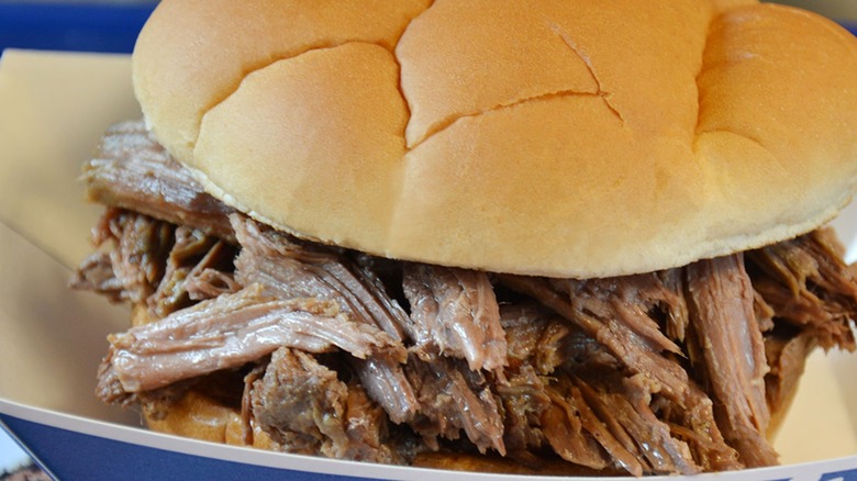 A close-up of the Culver's beef pot roast sandwich in a paper tray