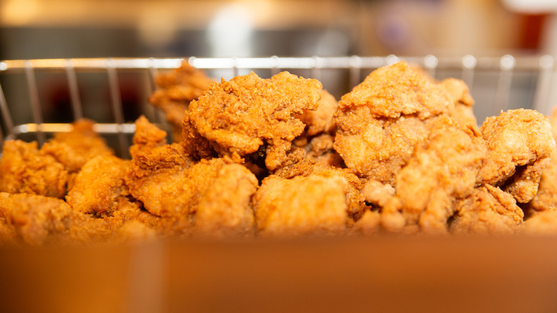 Close-up of fried chicken wings in a basket