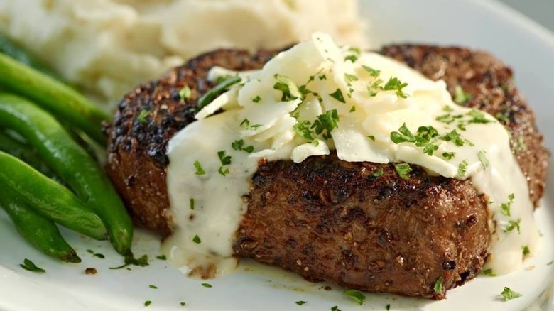 Sirloin steak with cheese sauce, mashed potatoes, and green beans from Ruby Tuesday