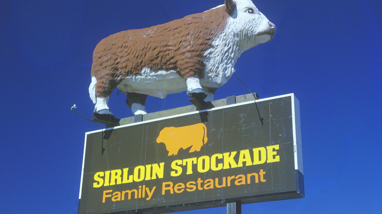 Sirloin Stockade sign with cow on top