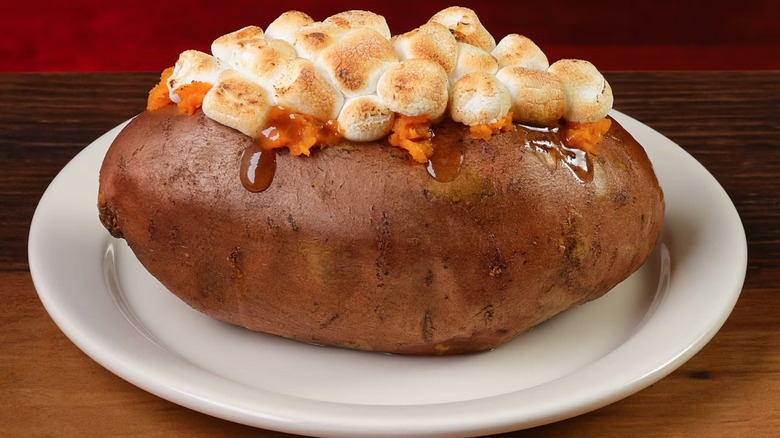 Texas Roadhouse sweet potato topped with toasted marshmallows and caramel sauce.