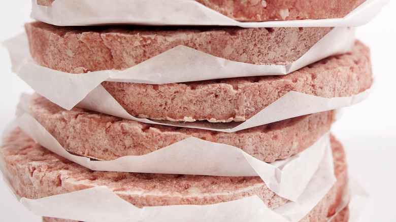 Frozen burger patties stacked up