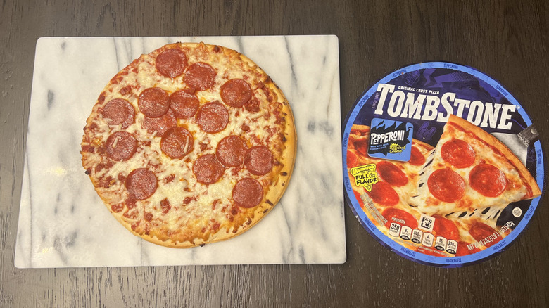 Tombstone Original Thin Crust Pepperoni Pizza on serving board.