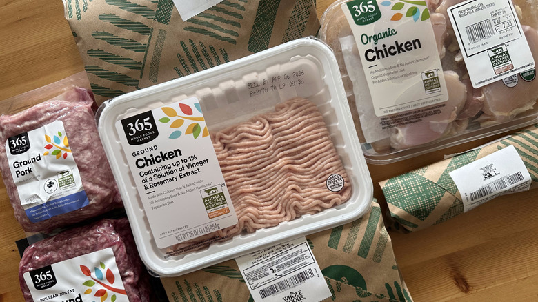 Packaged meats from Whole Foods on wooden table