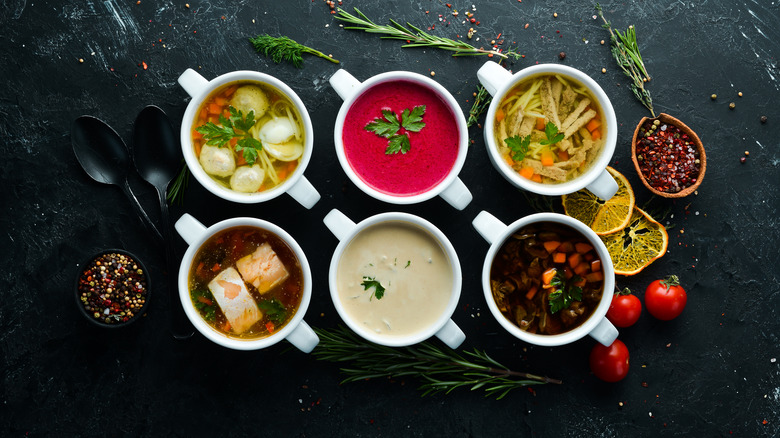 six bowls of different soups.