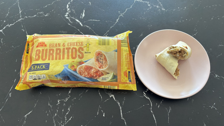 Aldi burritos package next to halved burrito on plate
