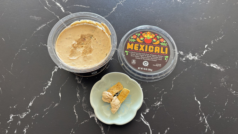Aldi Mexicali dip container next to bowl with Fritos and dip