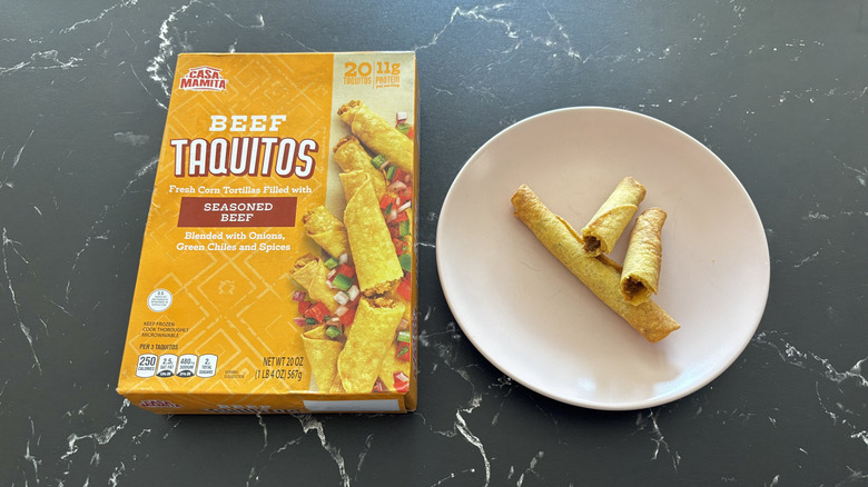 Aldi beef taquitos box next to taquitos on plate