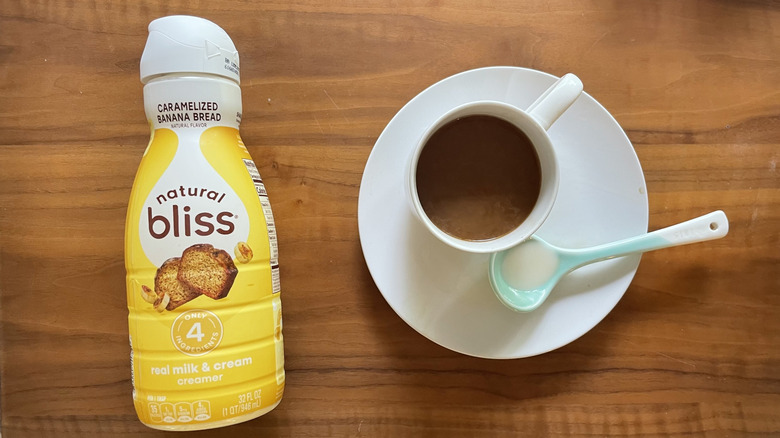 Bliss Creamer in a bottle and in a coffee cup