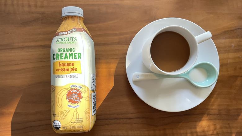 Sprouts creamer in a bottle and in a coffee cup
