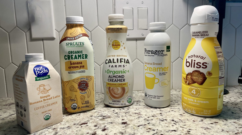 Assorted banana flavored creamers on a granite surface