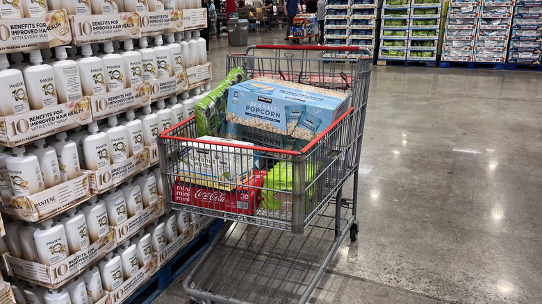 A full shopping cart in a Costco warehouse
